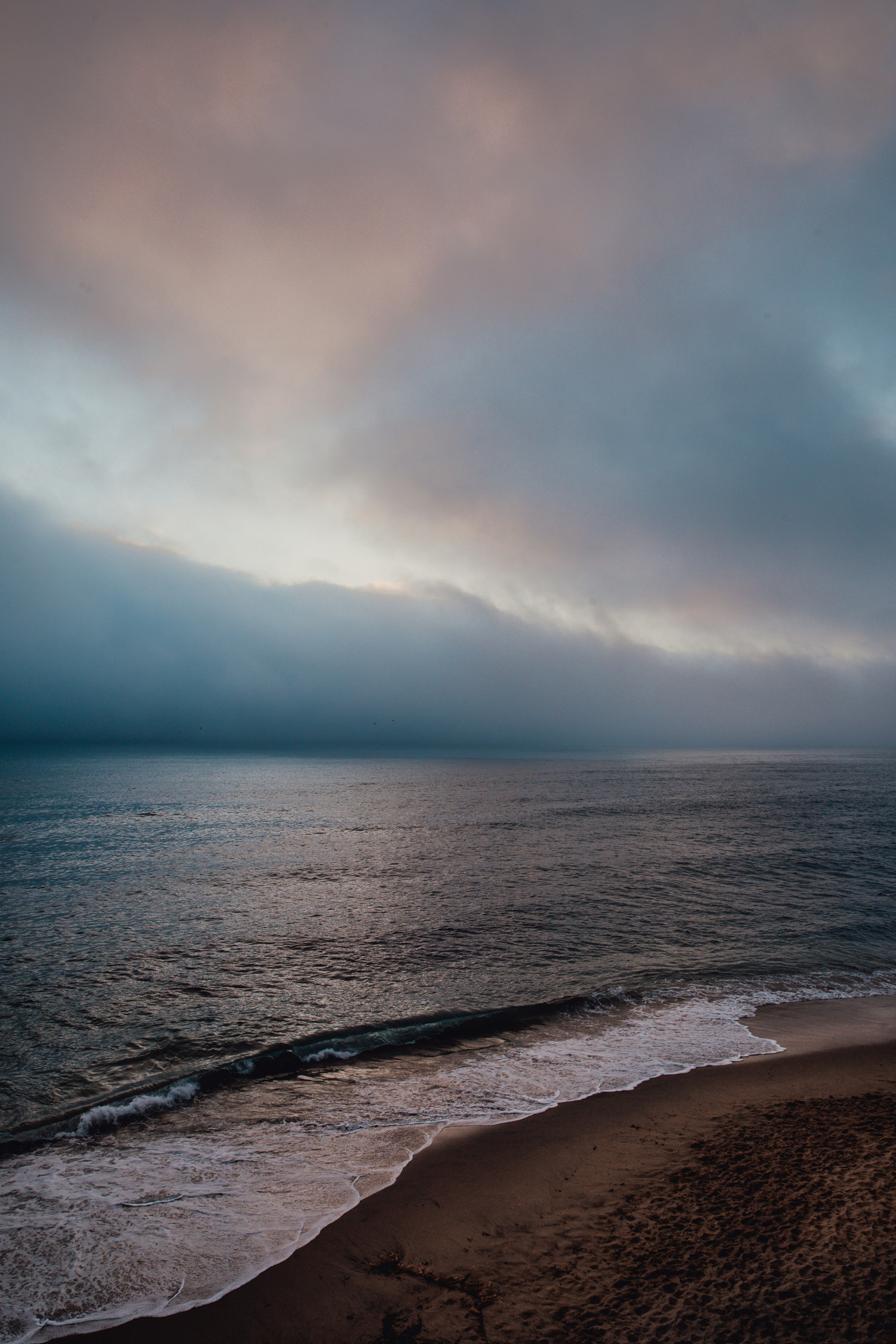 ocean under cloudy sky during daytime